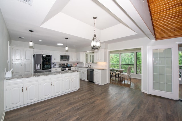 303 Llano Bnd, Holly Lake Ranch, TX 75765 - kitchen featuring stainless steel appliances, white cabinetry, a peninsula, dark wood-type flooring, and recessed lighting