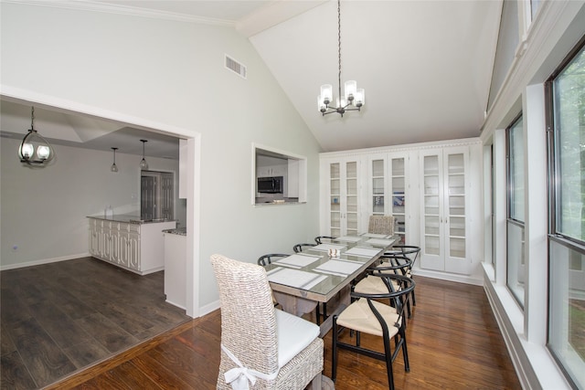 303 Llano Bnd, Holly Lake Ranch, TX 75765 - dining space with a chandelier, high vaulted ceiling, and dark wood finished floors
