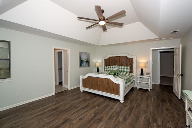 303 Llano Bnd, Holly Lake Ranch, TX 75765 - bedroom featuring dark wood-style flooring, a raised ceiling, and ceiling fan