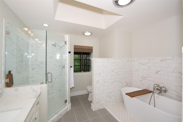 303 Llano Bnd, Holly Lake Ranch, TX 75765 - full bathroom featuring a freestanding tub, a stall shower, vanity, tile patterned floors, and recessed lighting