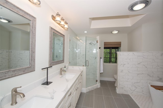 303 Llano Bnd, Holly Lake Ranch, TX 75765 - full bathroom with a shower stall, a soaking tub, double vanity, tile patterned flooring, and recessed lighting