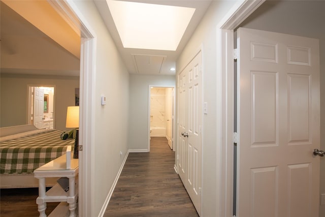 303 Llano Bnd, Holly Lake Ranch, TX 75765 - hallway with attic access and dark wood-type flooring