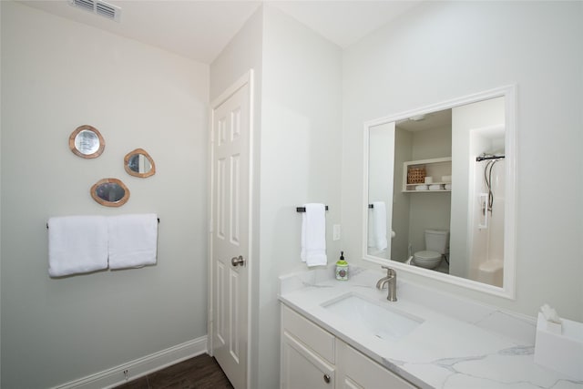303 Llano Bnd, Holly Lake Ranch, TX 75765 - bathroom featuring vanity and wood finished floors