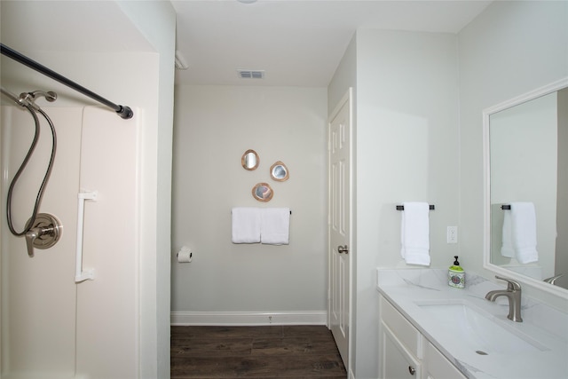 303 Llano Bnd, Holly Lake Ranch, TX 75765 - bathroom with vanity and wood finished floors