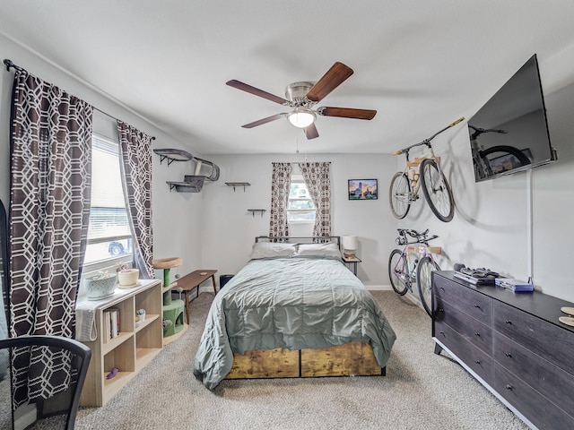 7831 San Jose Ave, Dallas, TX 75241 - bedroom featuring multiple windows, carpet flooring, a ceiling fan, and baseboards
