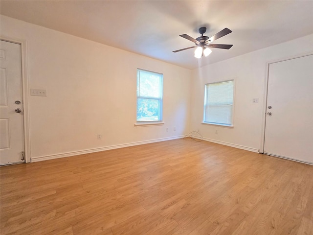 201 Paschal, Troup, TX 75789 - spare room with light wood-style floors, a ceiling fan, and baseboards