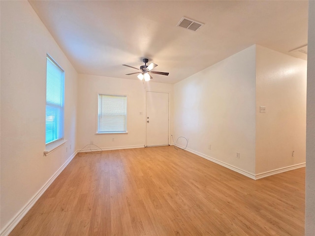 201 Paschal, Troup, TX 75789 - spare room featuring light wood-type flooring, baseboards, and a ceiling fan