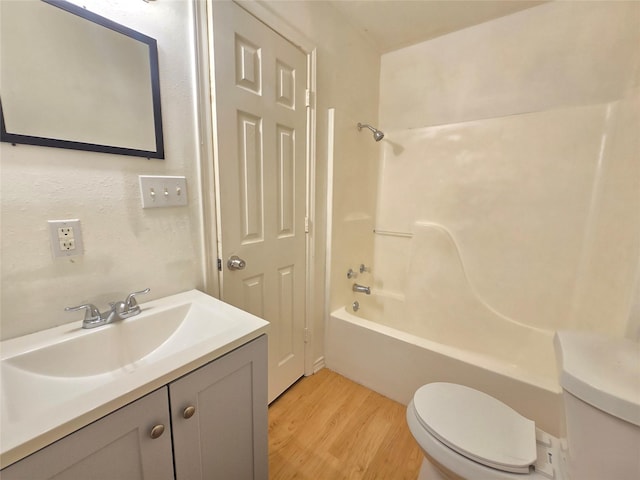 201 Paschal, Troup, TX 75789 - full bath featuring toilet, wood finished floors, vanity, and bathtub / shower combination