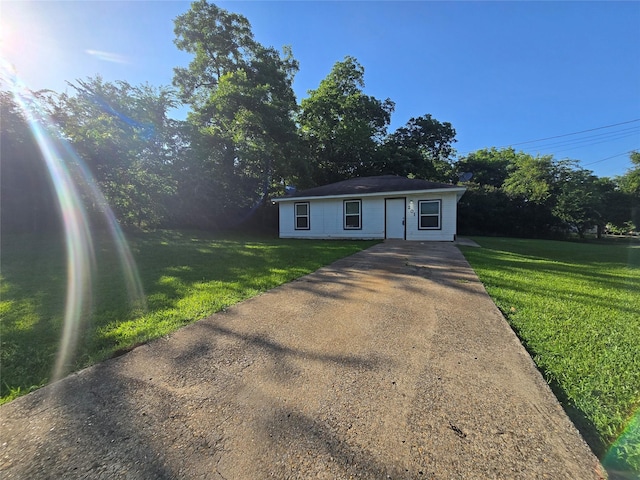 201 Paschal, Troup, TX 75789 - single story home with driveway and a front yard