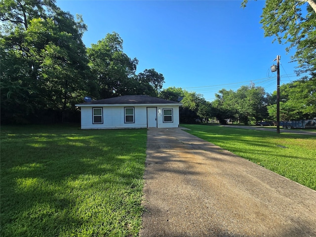 201 Paschal, Troup, TX 75789 - view of front of house featuring a front lawn and driveway