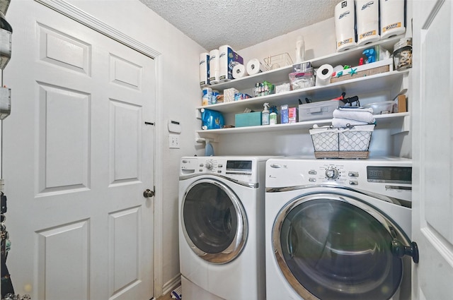 1693 Castle Rock Dr, Lewisville, TX 75077 - washroom featuring washing machine and clothes dryer and a textured ceiling