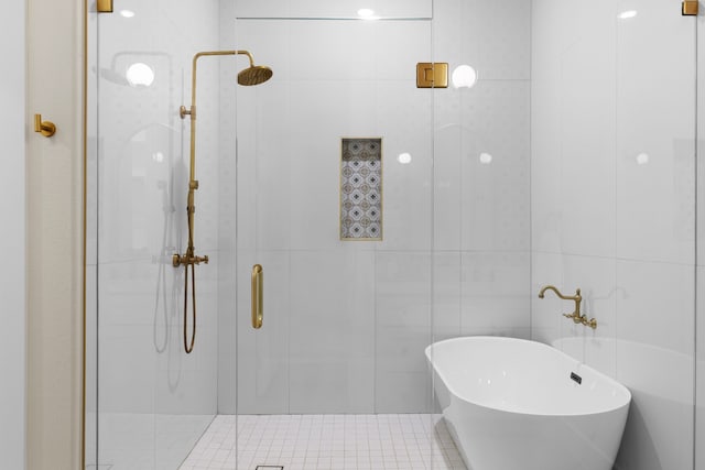 1228 Gould Ave, Fort Worth, TX 76164 - bathroom with tile walls, a shower stall, and a freestanding tub