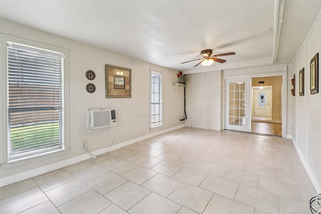 2622 Briar Hill Dr, Carrollton, TX 75007 - spare room featuring a ceiling fan, a wall mounted air conditioner, baseboards, and light tile patterned flooring