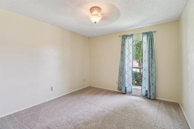 2622 Briar Hill Dr, Carrollton, TX 75007 - carpeted spare room featuring a textured ceiling and baseboards