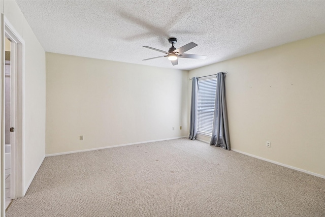 2622 Briar Hill Dr, Carrollton, TX 75007 - spare room with ceiling fan, light carpet, a textured ceiling, and baseboards