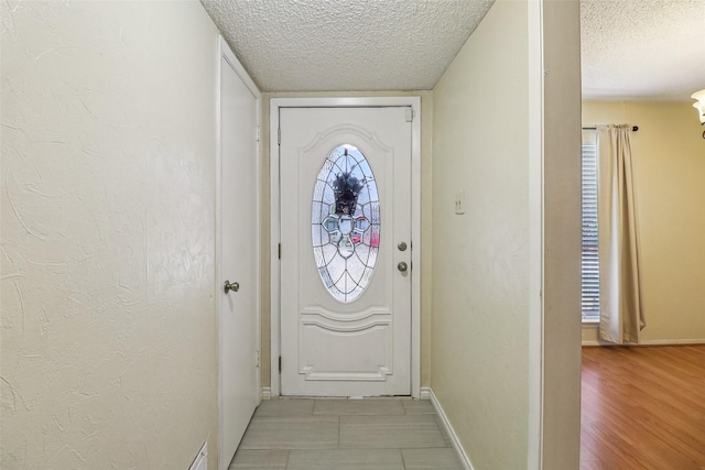 2622 Briar Hill Dr, Carrollton, TX 75007 - doorway with a textured ceiling and baseboards