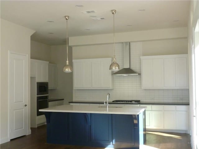 6813 Royal View Dr, Mckinney, TX 75070 - kitchen with wall chimney range hood, black oven, a sink, tasteful backsplash, and stainless steel microwave