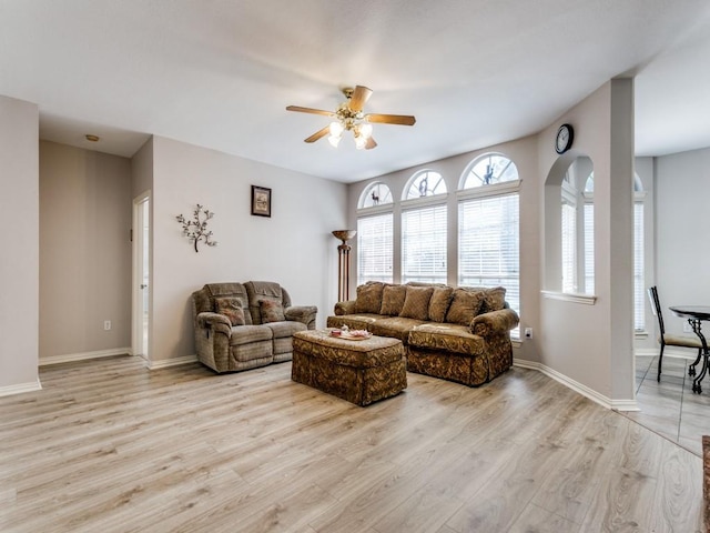 100 Branchwood Trl, Coppell, TX 75019 - living area with a ceiling fan, light wood-style floors, and baseboards