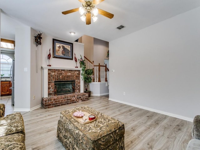 100 Branchwood Trl, Coppell, TX 75019 - living area featuring light wood-style floors, ceiling fan, baseboards, and stairway
