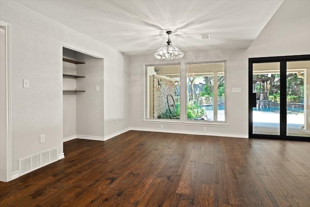 3519 Lake Powell Dr, Arlington, TX 76016 - unfurnished dining area featuring dark wood-style flooring, a chandelier, and baseboards