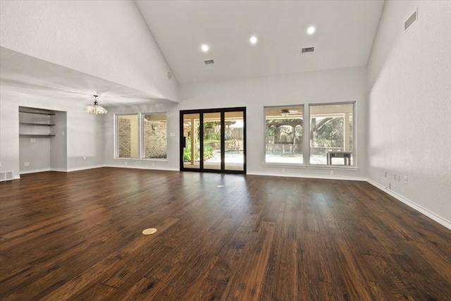 3519 Lake Powell Dr, Arlington, TX 76016 - unfurnished living room with high vaulted ceiling, a chandelier, wood finished floors, baseboards, and recessed lighting