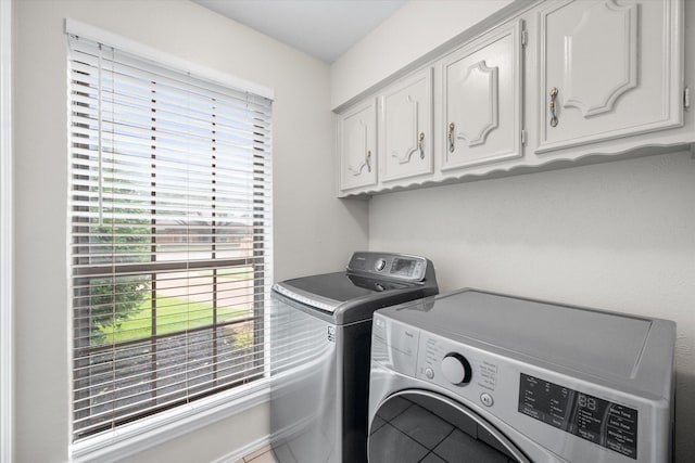 240 Highland Knl, Highland Village, TX 75077 - laundry area featuring independent washer and dryer, cabinet space, and tile patterned floors