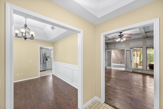 240 Highland Knl, Highland Village, TX 75077 - empty room featuring wood finished floors, a chandelier, ceiling fan, a decorative wall, and coffered ceiling