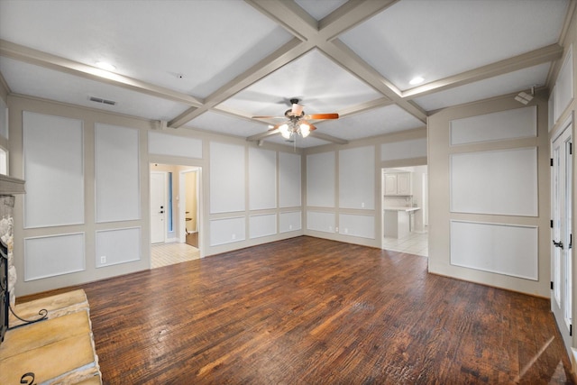 240 Highland Knl, Highland Village, TX 75077 - unfurnished living room featuring a decorative wall, a ceiling fan, coffered ceiling, wood finished floors, and beamed ceiling