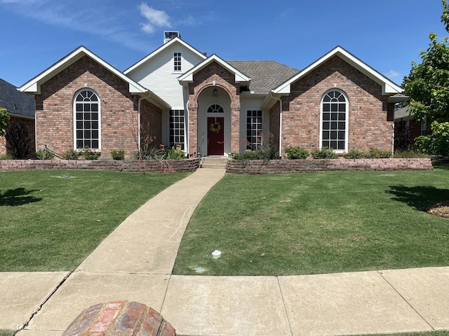 2900 Boyd St, Ennis, TX 75119 - view of front of house with brick siding and a front lawn