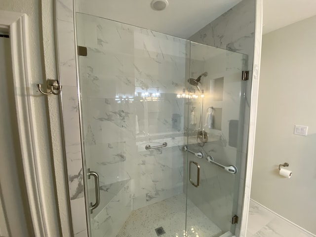 2900 Boyd St, Ennis, TX 75119 - bathroom with a marble finish shower and marble look tiles