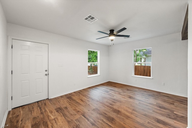 1111 N 11th St, Waco, TX 76707 - empty room featuring wood finished floors, a ceiling fan, and baseboards