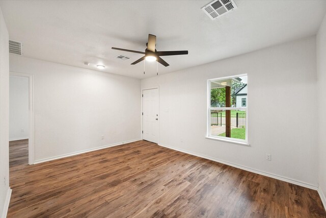 1111 N 11th St, Waco, TX 76707 - spare room featuring wood finished floors, baseboards, and a ceiling fan