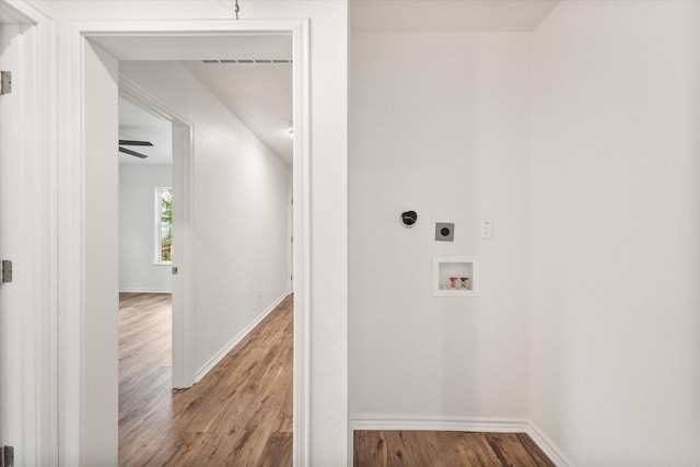 1111 N 11th St, Waco, TX 76707 - washroom with electric dryer hookup, wood finished floors, washer hookup, and baseboards