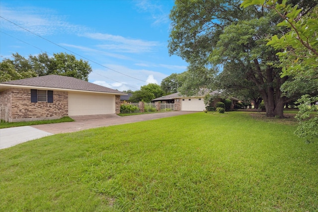 201 Harris Dr, Sunnyvale, TX 75182 - view of side of property featuring concrete driveway, a lawn, brick siding, and a garage