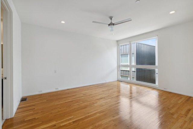 2706 Throckmorton St Unit C, Dallas, TX 75219 - spare room with light wood-style flooring, ceiling fan, recessed lighting, and baseboards
