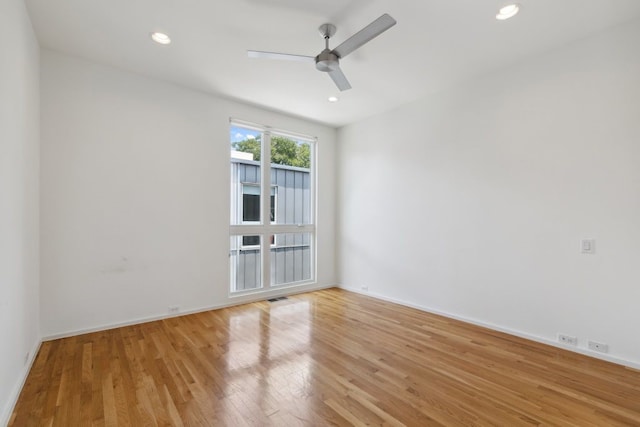 2706 Throckmorton St Unit C, Dallas, TX 75219 - empty room with light wood-style flooring, ceiling fan, baseboards, and recessed lighting