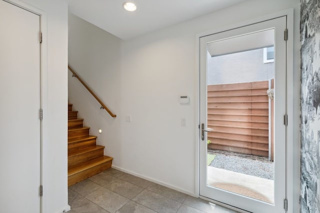 2706 Throckmorton St Unit C, Dallas, TX 75219 - foyer featuring light tile patterned floors, stairs, baseboards, and recessed lighting