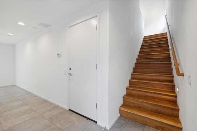 2706 Throckmorton St Unit C, Dallas, TX 75219 - stairs with recessed lighting and tile patterned floors