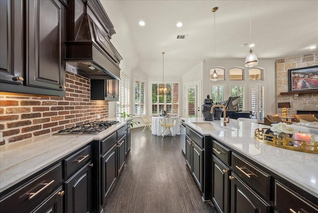 2223 Alisa Ln, Trophy Club, TX 76262 - kitchen featuring stainless steel gas cooktop, custom exhaust hood, a sink, dark wood finished floors, and open floor plan