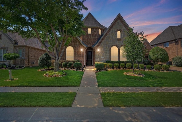 2223 Alisa Ln, Trophy Club, TX 76262 - view of front of house with a front lawn, brick siding, and stone siding