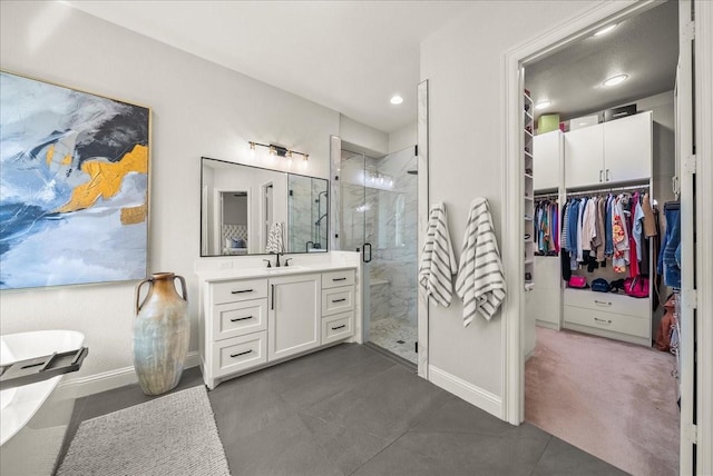 2223 Alisa Ln, Trophy Club, TX 76262 - full bathroom with vanity, a stall shower, baseboards, a spacious closet, and recessed lighting