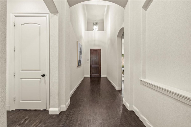 2223 Alisa Ln, Trophy Club, TX 76262 - hall with arched walkways, dark wood-type flooring, baseboards, and a textured wall