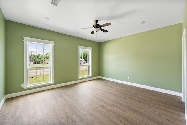 3231 Hillsdale Ave, Corsicana, TX 75110 - spare room featuring a ceiling fan, wood finished floors, and baseboards