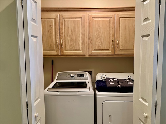 201 Park Rd, Nocona, TX 76255 - laundry area with washing machine and dryer and cabinet space