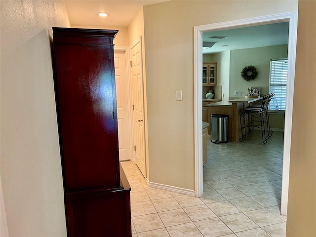 201 Park Rd, Nocona, TX 76255 - corridor featuring light tile patterned flooring, baseboards, and recessed lighting