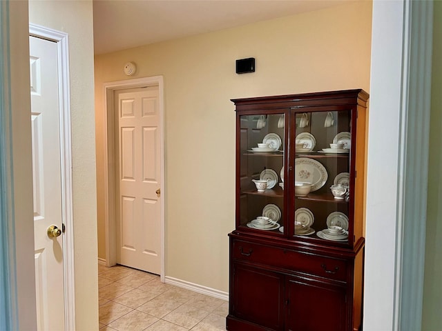 201 Park Rd, Nocona, TX 76255 - hallway featuring light tile patterned floors and baseboards