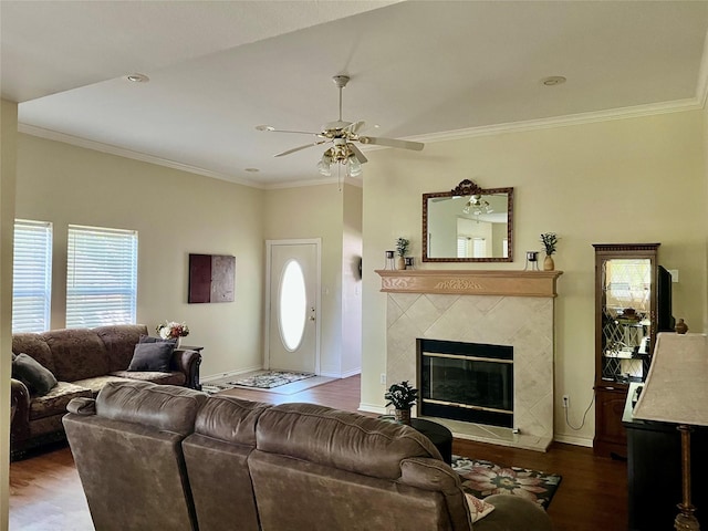 201 Park Rd, Nocona, TX 76255 - living area with healthy amount of natural light, wood finished floors, ornamental molding, a ceiling fan, and baseboards