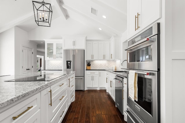 610 Sunset Ct, Argyle, TX 76226 - kitchen with appliances with stainless steel finishes, a sink, tasteful backsplash, white cabinetry, and dark wood-style floors