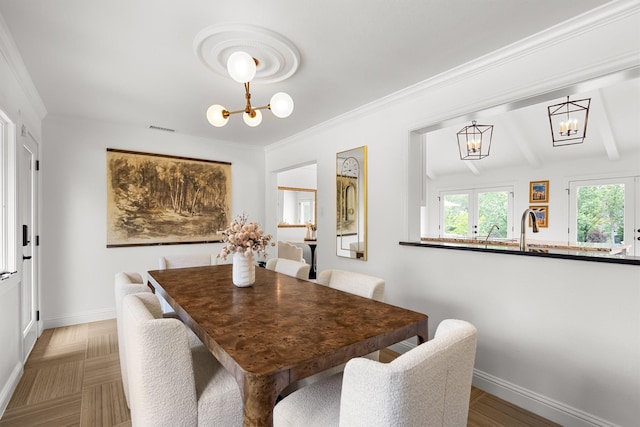 610 Sunset Ct, Argyle, TX 76226 - dining area with a chandelier, baseboards, and crown molding