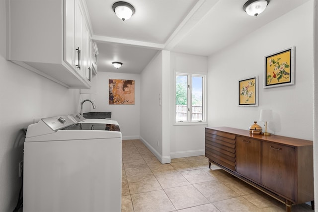 610 Sunset Ct, Argyle, TX 76226 - laundry area with cabinet space, separate washer and dryer, baseboards, and light tile patterned floors
